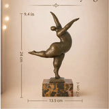 Abstract bronze female sculpture in a graceful dance pose on marble base, modern home decor accent