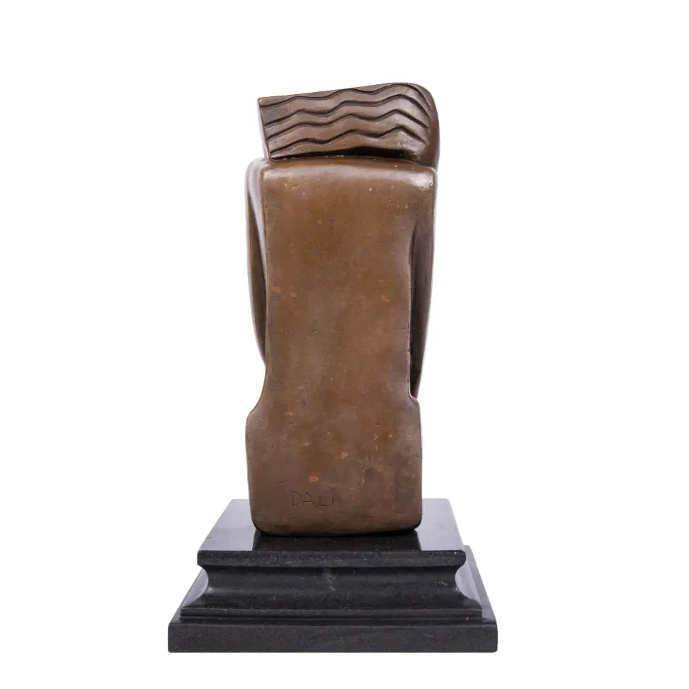 Art Deco seated female bronze statue with geometric design and olive branch detail