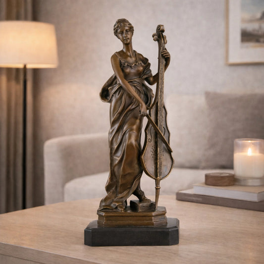 Elegant Art Nouveau bronze female cellist statue in flowing gown, woman playing cello sculpture on stepped black marble base, loss wax casting musical fine art.