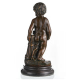 Bronze putto statue with cornucopia symbolizing abundance on marble base