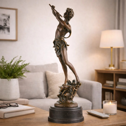 Classical bronze sculpture of Greek god Pan playing syrinx pan flute, athletic mythological figure on cylindrical black marble base, loss wax casting art for home library.