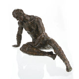 Contemporary bronze sculpture crouching male figure with chessboard symbols pattern, conceptual human form statue mid-movement, loss wax casting avant-garde art.