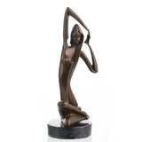 Art Deco bronze sculpture of a kneeling woman with raised arm and veil, stylized female figure on round black marble base, loss wax casting abstract art.