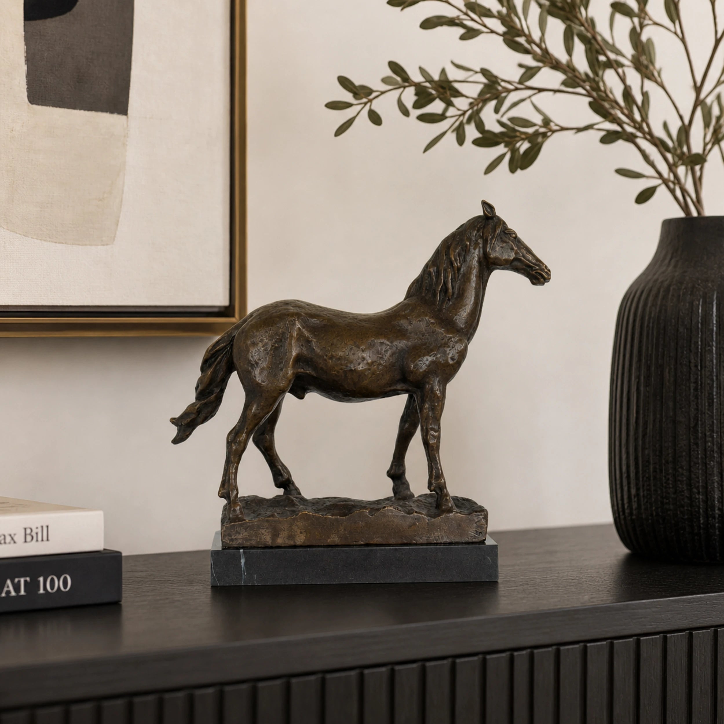 Naturalistic standing bronze horse sculpture with detailed musculature and flowing mane, realistic equestrian statue on black marble base, lost wax casting fine art.
