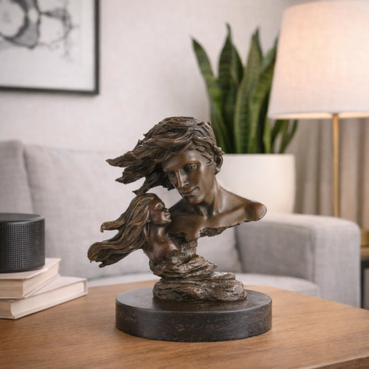 Modern romantic bronze sculpture of a couple in love with billowing hair, windswept lovers floating bust on round black marble base, loss wax casting romantic art.