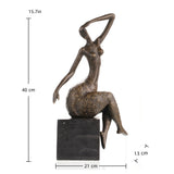 Contemporary abstract bronze seated female sculpture with golden floral motifs, graceful woman statue with raised arm on black marble base, loss wax casting modern art.