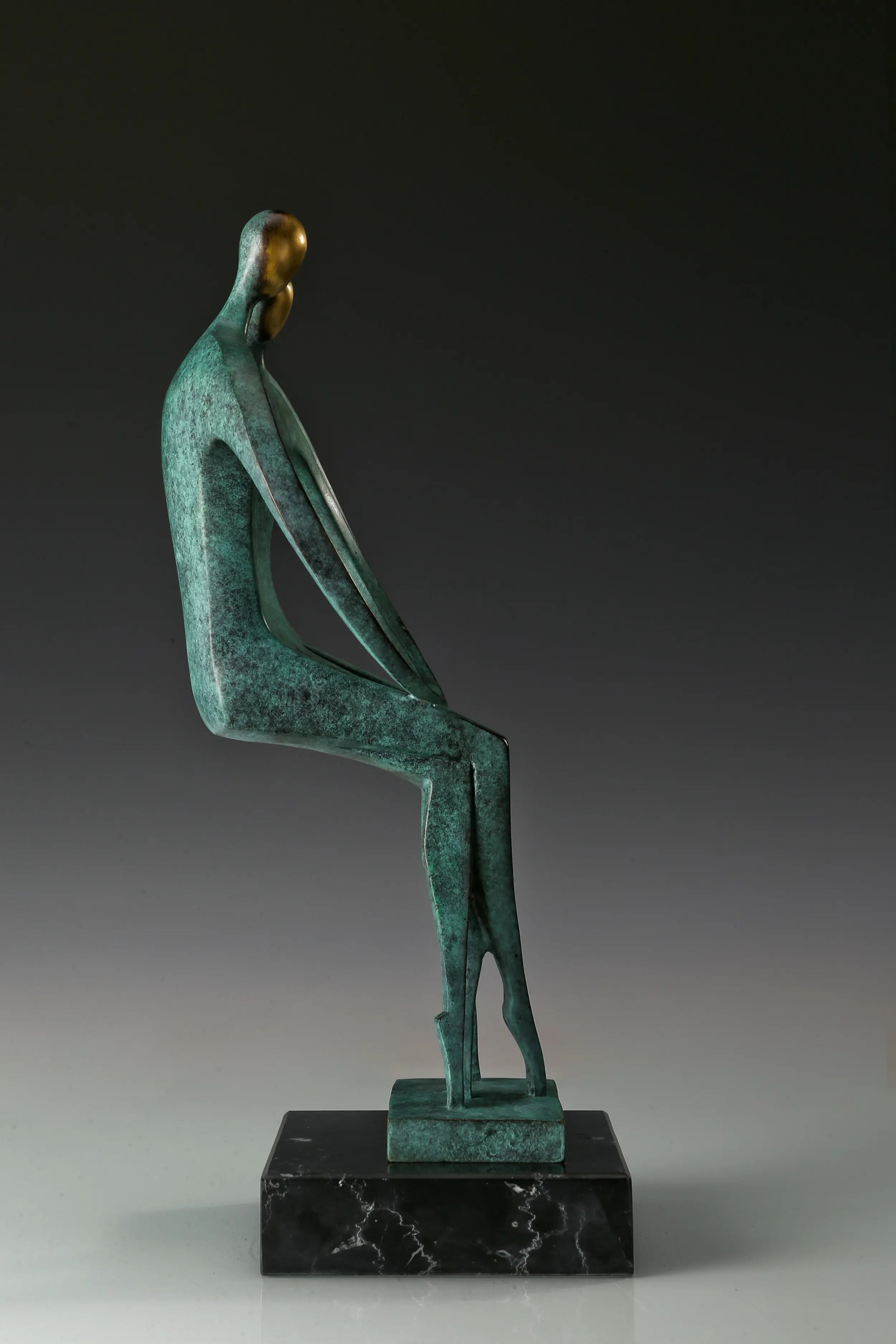 Opposite side view of contemporary bronze couple sculpture with elongated legs
