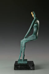 Side profile of two abstract bronze figures leaning toward each other