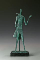 Back view of abstract bronze couple statue showing its angular forms and green patina