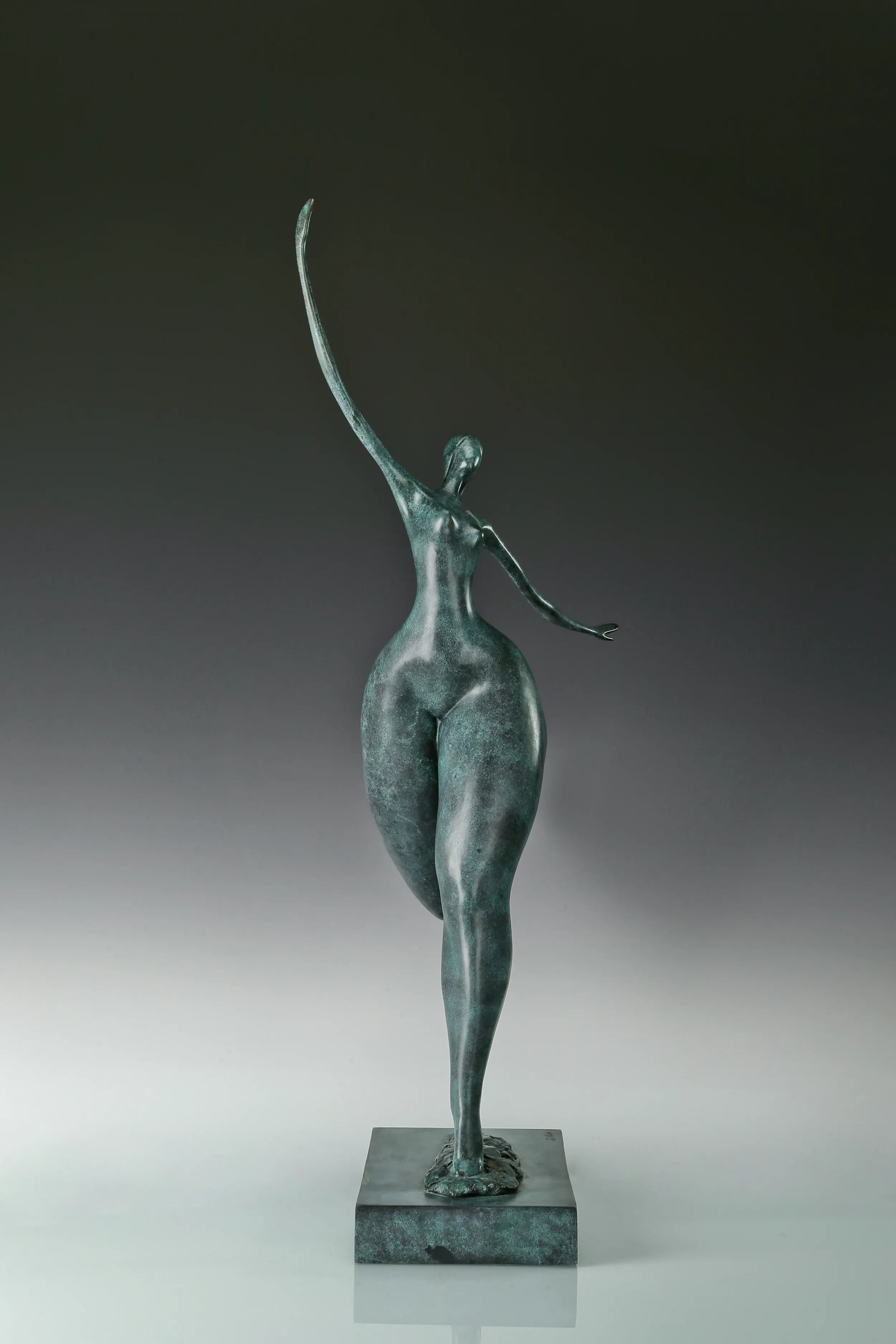 Front view of abstract dancer bronze sculpture balancing on one leg with outstretched arms
