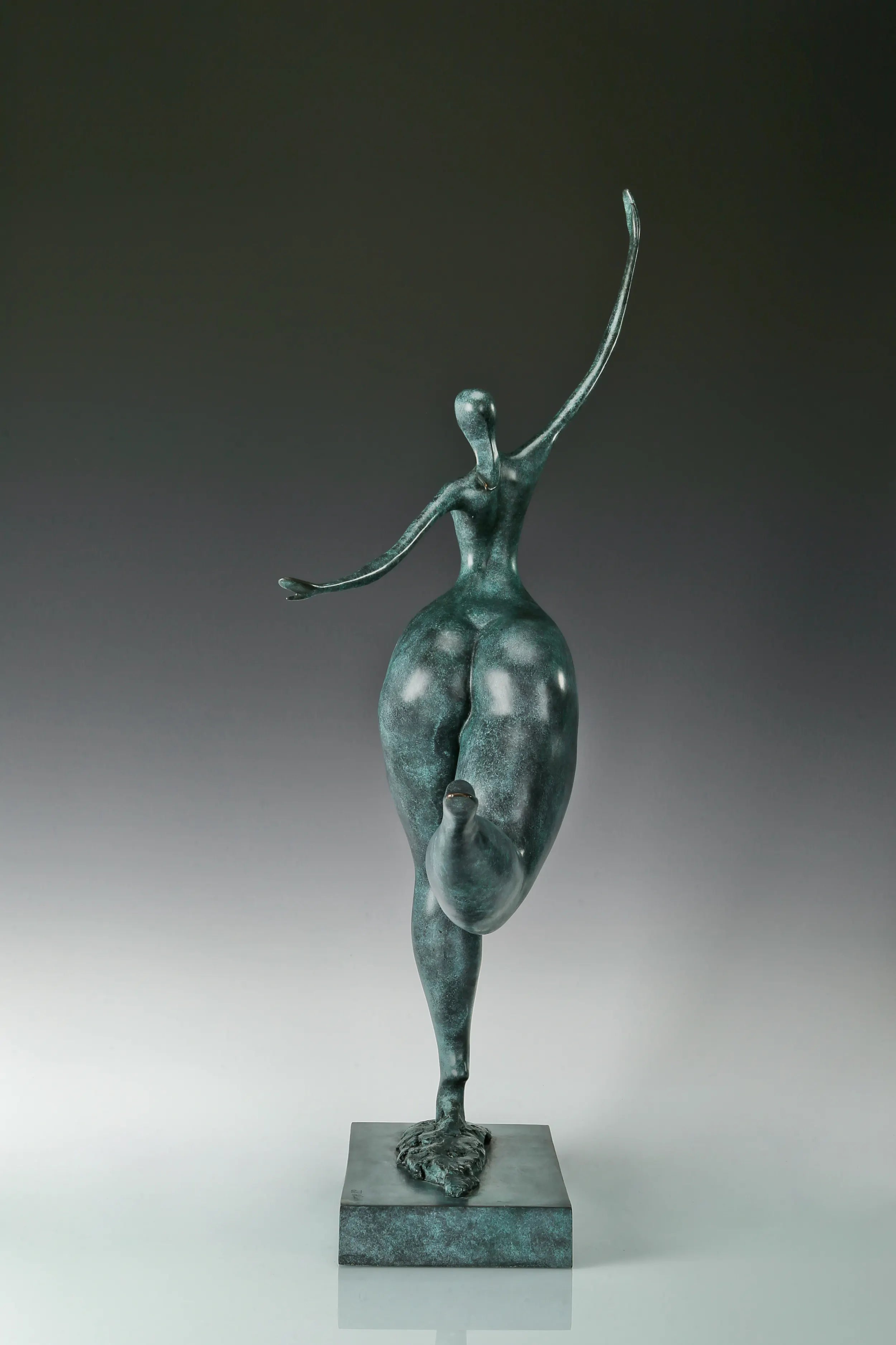 Back view of abstract dancing woman bronze sculpture showing its sculpted silhouette