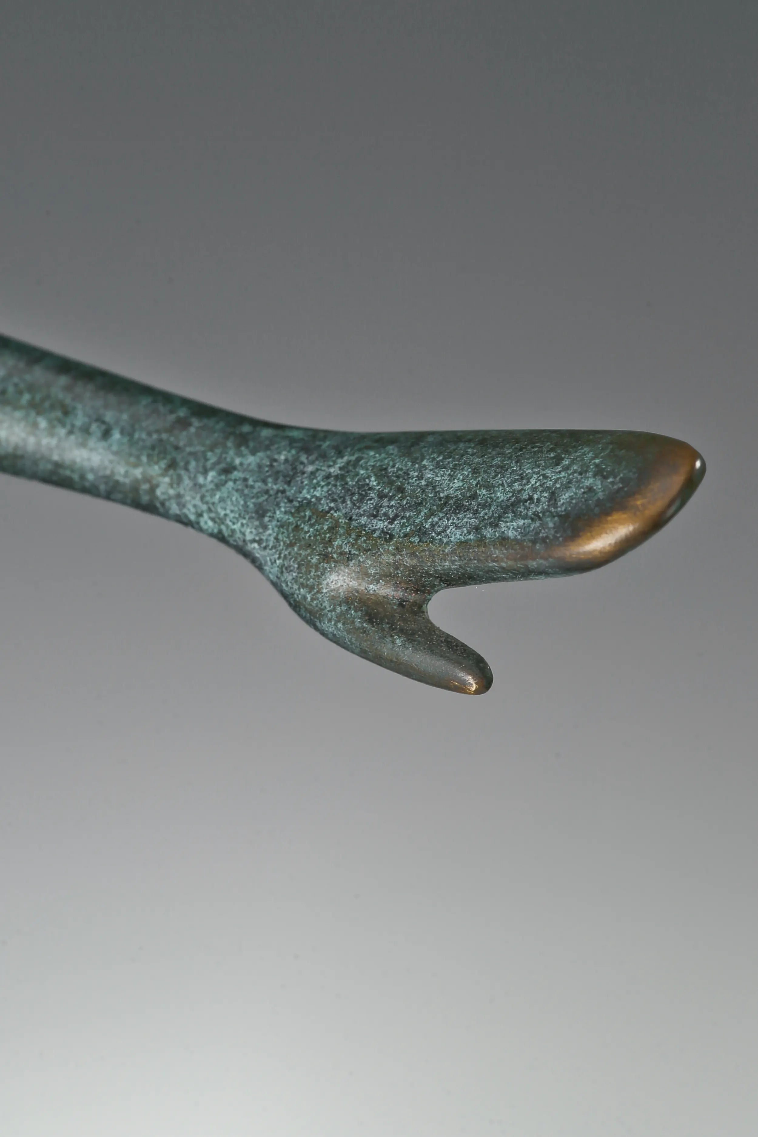 Close-up of abstract female dancer bronze statue showing her hand