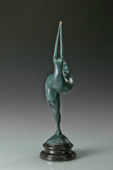 Side profile of abstract gymnast statue with elongated raised arms