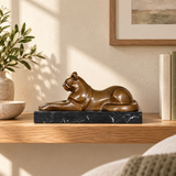Abstract resting cat bronze statue displayed in an elegant home interior