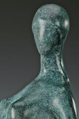 Close-up of abstract woman's smooth featureless face and elongated neck