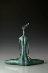 Back view of green patina bronze meditation figure with folded legs