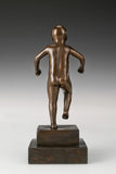 Rear view of handcrafted angry boy bronze sculpture showing full figurative form