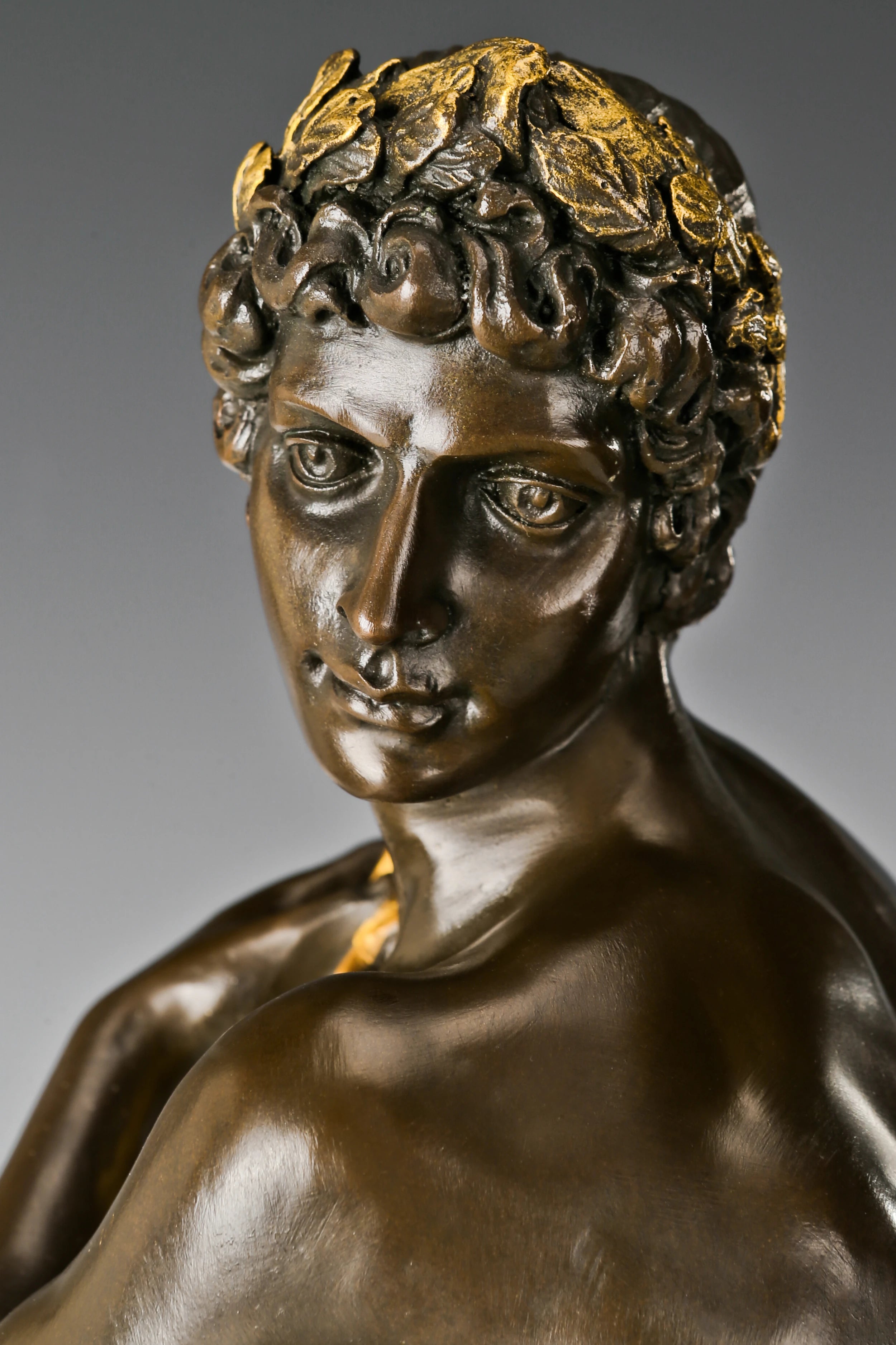 Close-up detail of Apollo classical bronze male figure