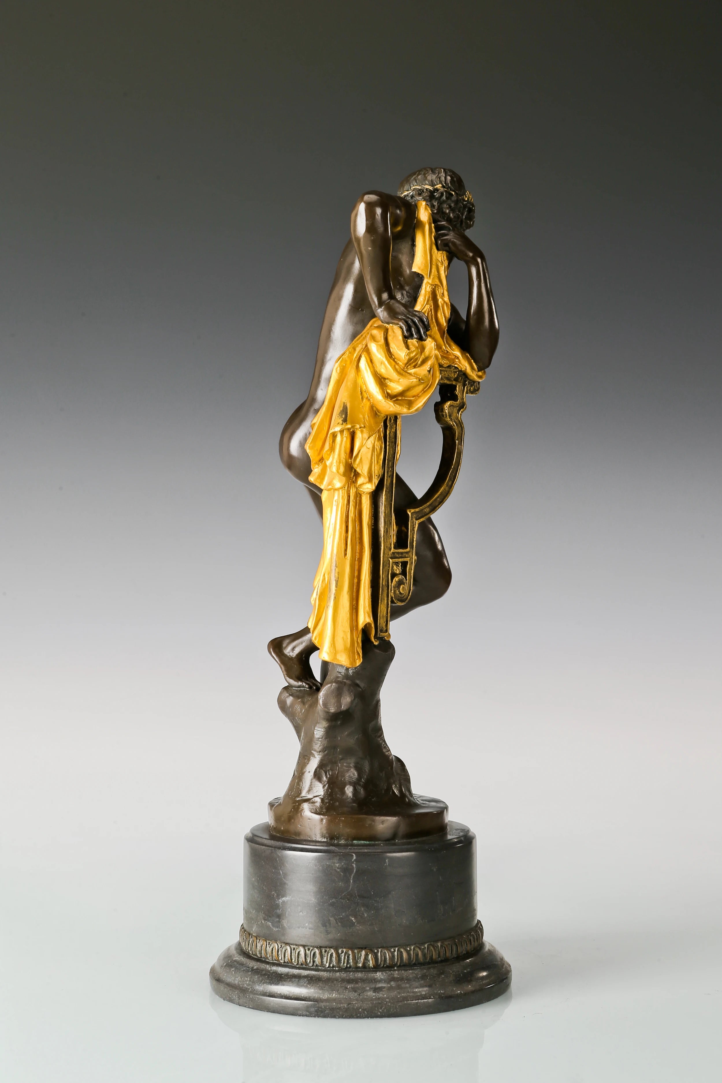 Right side view of Apollo bronze sculpture showing lyre details