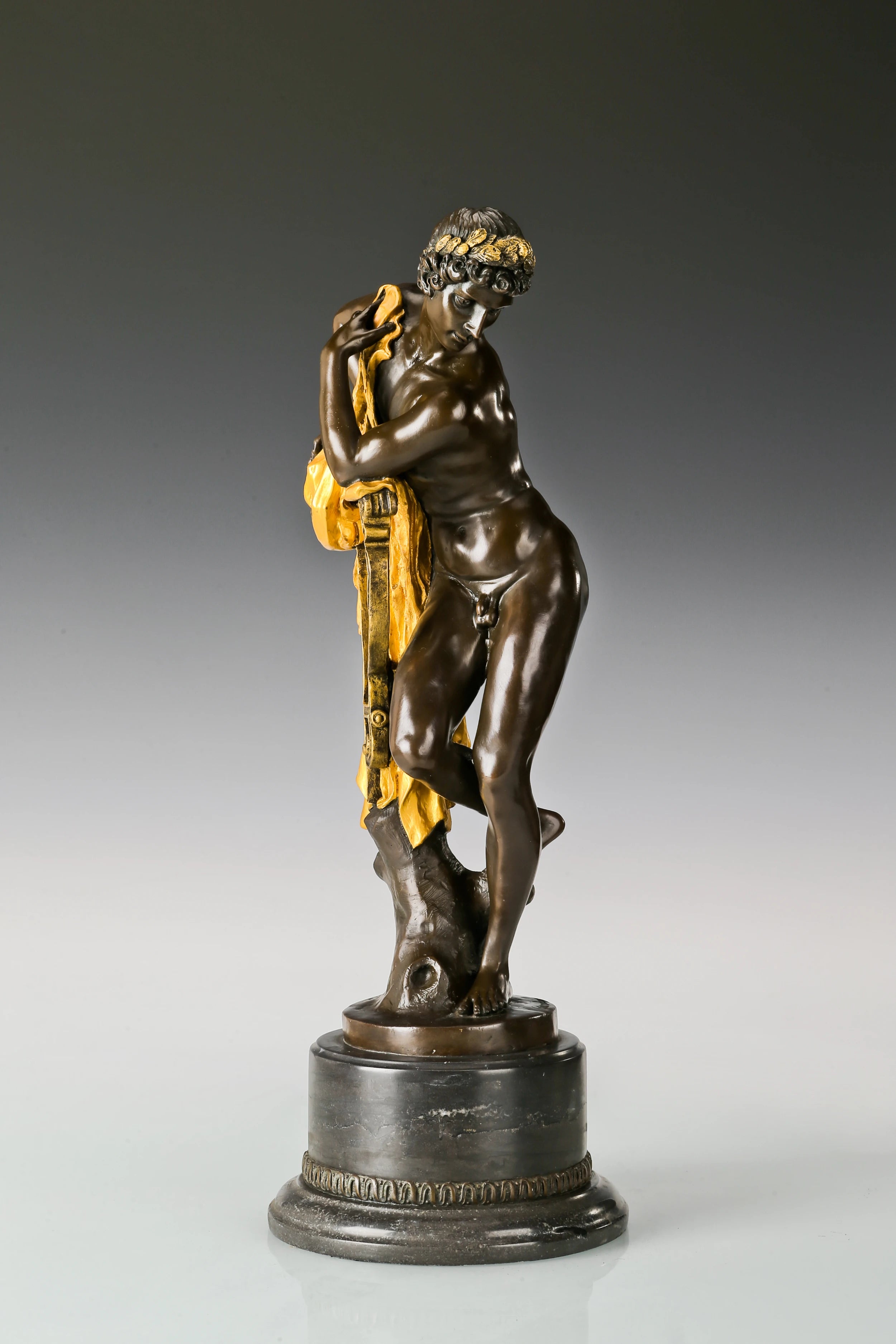 Left side view of Apollo Greek god sculpture with detailed drapery