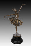 Side view of classical ballet dancer bronze statue showing the extended leg and flowing tutu