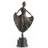 Art Deco bronze ballerina sculpture en pointe, Chiparus style dancer statue with pleated skirt on black marble base.