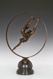 Three-quarter view of handcrafted ballerina bronze sculpture with circular design