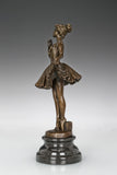 Full-length view of classical ballerina bronze statue on a black marble base