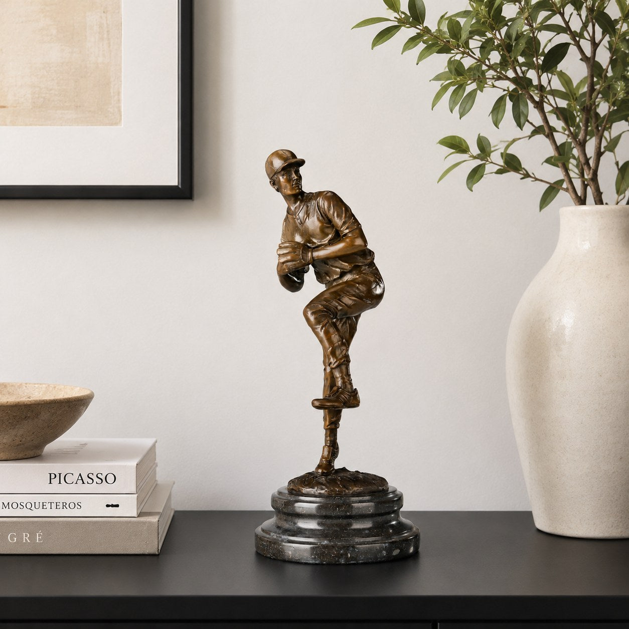 Baseball Pitcher bronze sculpture displayed in a refined interior setting