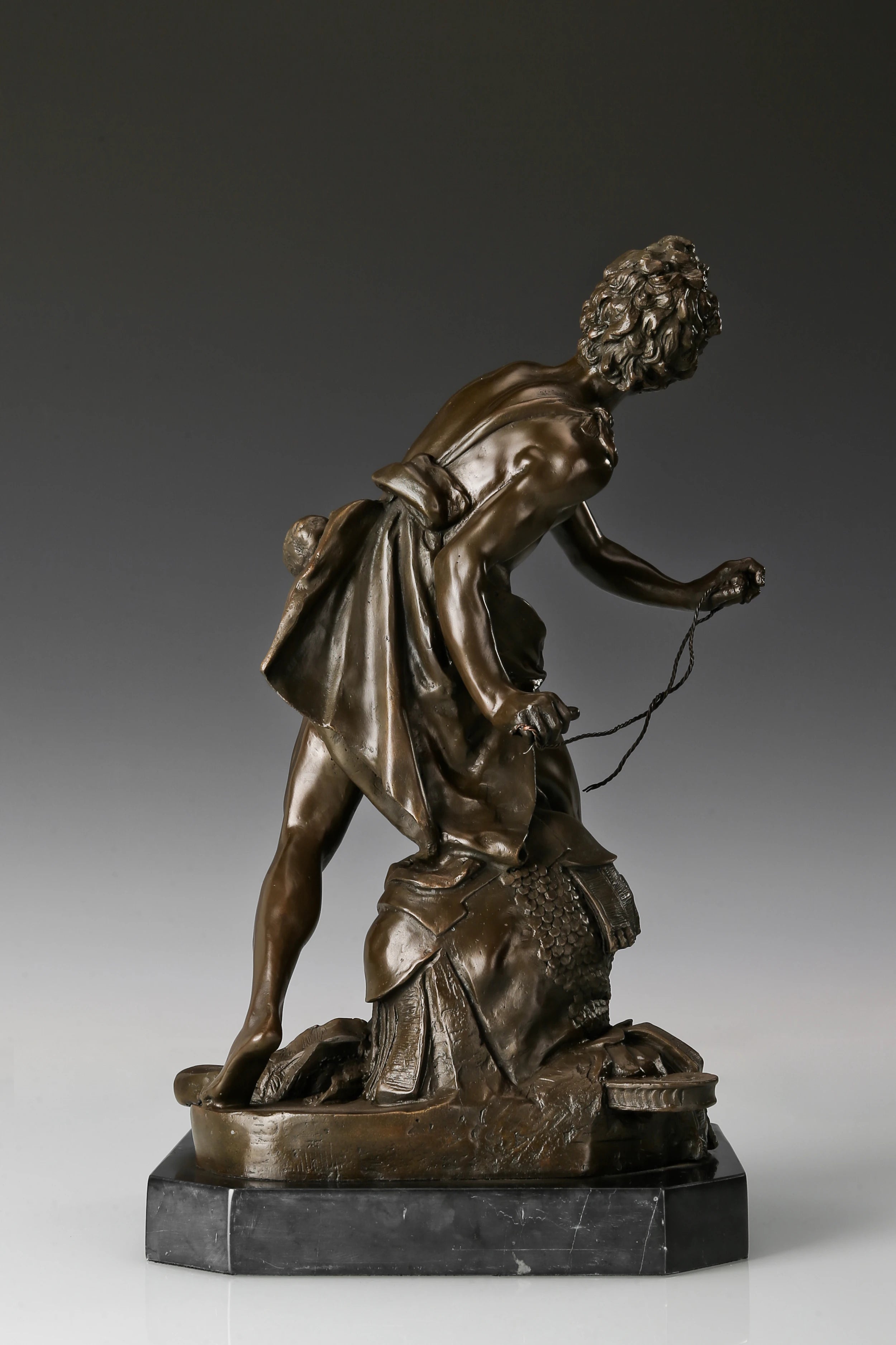 Rear view showing dynamic pose of Bernini David bronze statue
