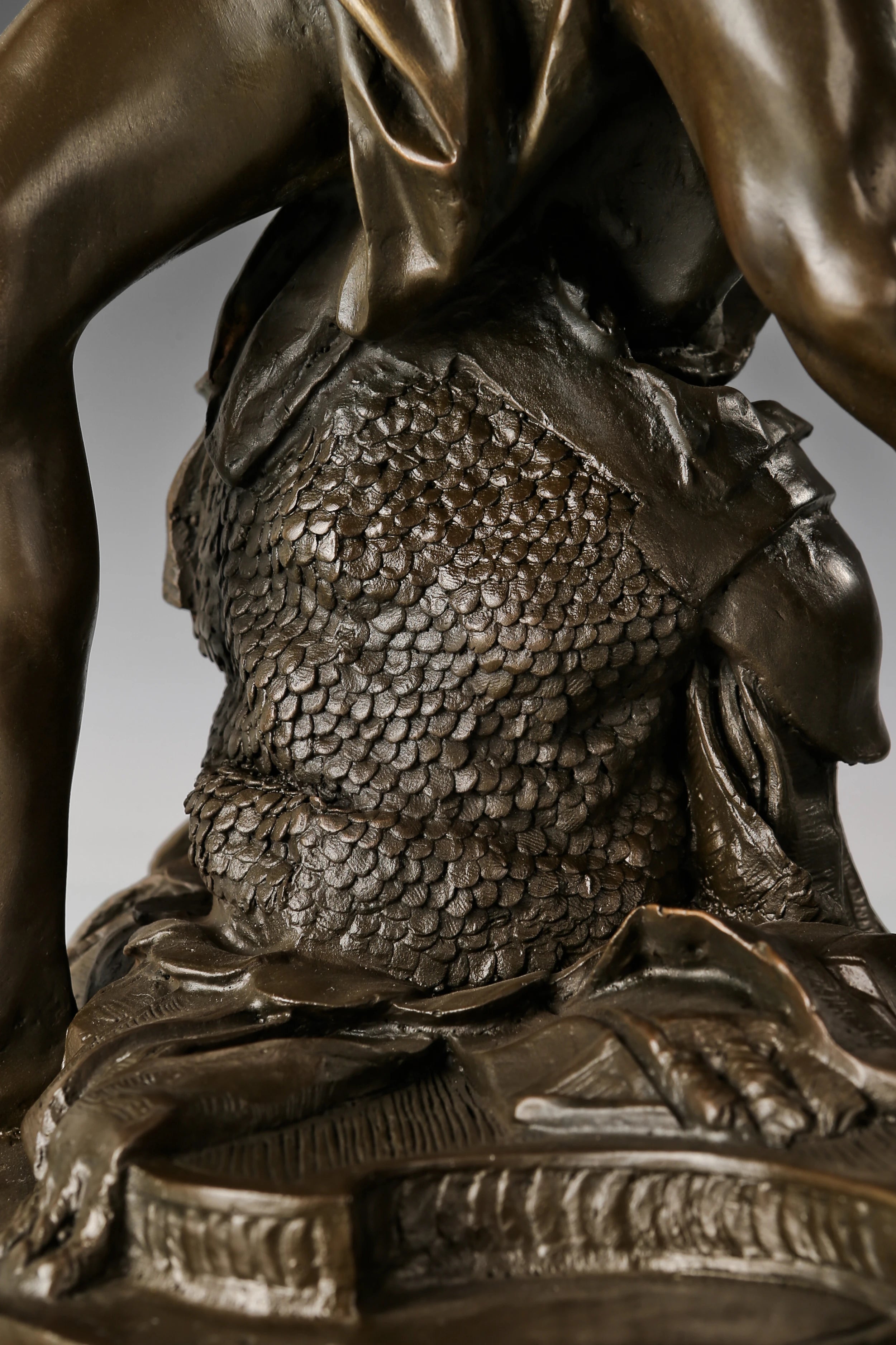 Natural marble base supporting the handcrafted Bernini David bronze sculpture