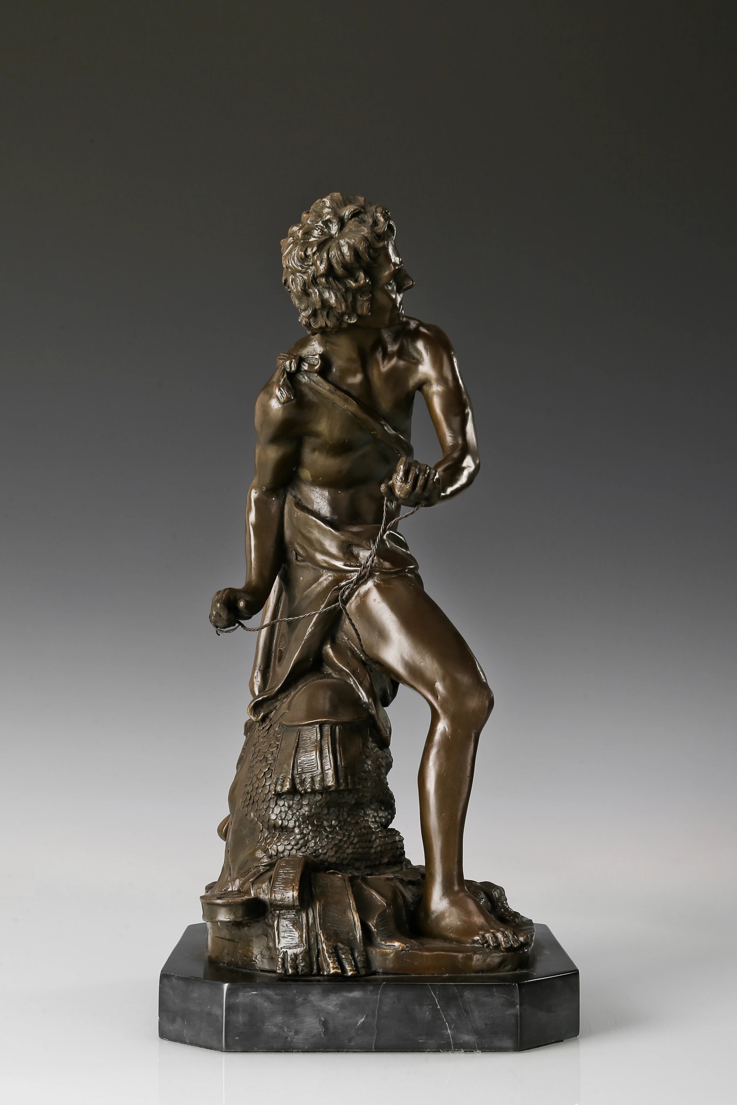 Right side view of David and Goliath bronze sculpture
