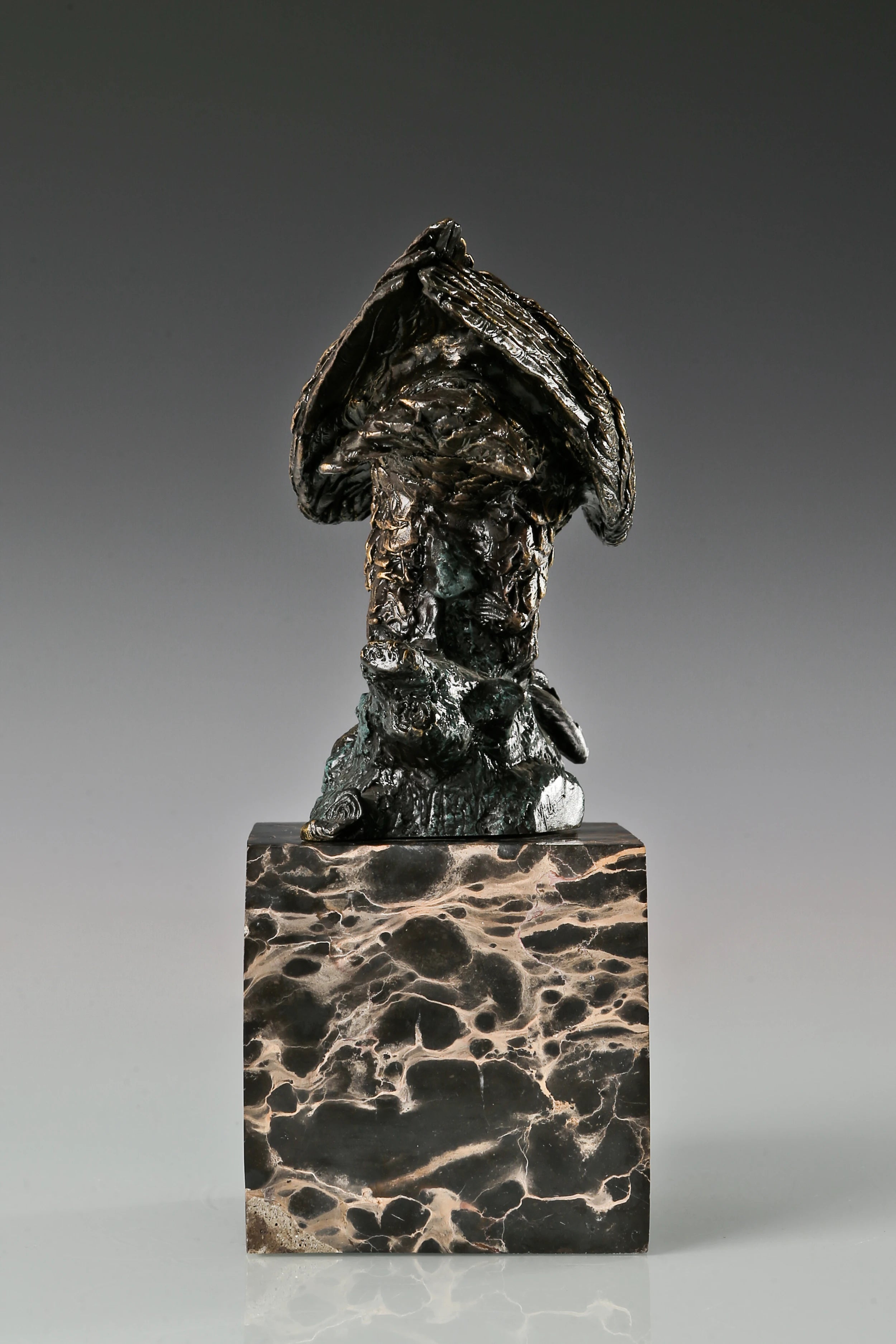 Bronze eagle sculpture ready to fly with wings partially spread and marble base. A powerful symbol of strength, freedom, and ambition.