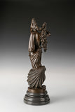 Rear view of Birth of Venus bronze sculpture showing flowing hair and drapery details