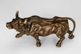 Detailed view of the handcrafted bronze bull sculpture highlighting realistic musculature and warm bronze patina.