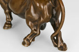 Detailed view of the handcrafted bronze bull sculpture highlighting realistic musculature and warm bronze patina.
