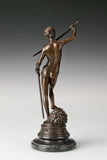 Rear view of bronze David and Goliath sculpture showing detailed anatomy