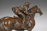 Close-up of bronze galloping racehorse showing muscular movement and sculpted athletic form