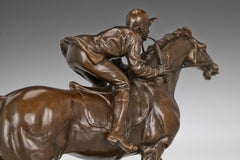 Close-up of bronze galloping racehorse showing muscular movement and sculpted athletic form