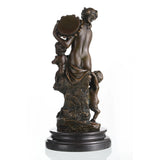 Rear view of classical bronze Bacchante sculpture highlighting detailed hair, drapery, and amphora.