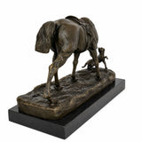 Rear view of bronze horse and dog sculpture showing horse tail, saddle details, and naturalistic composition