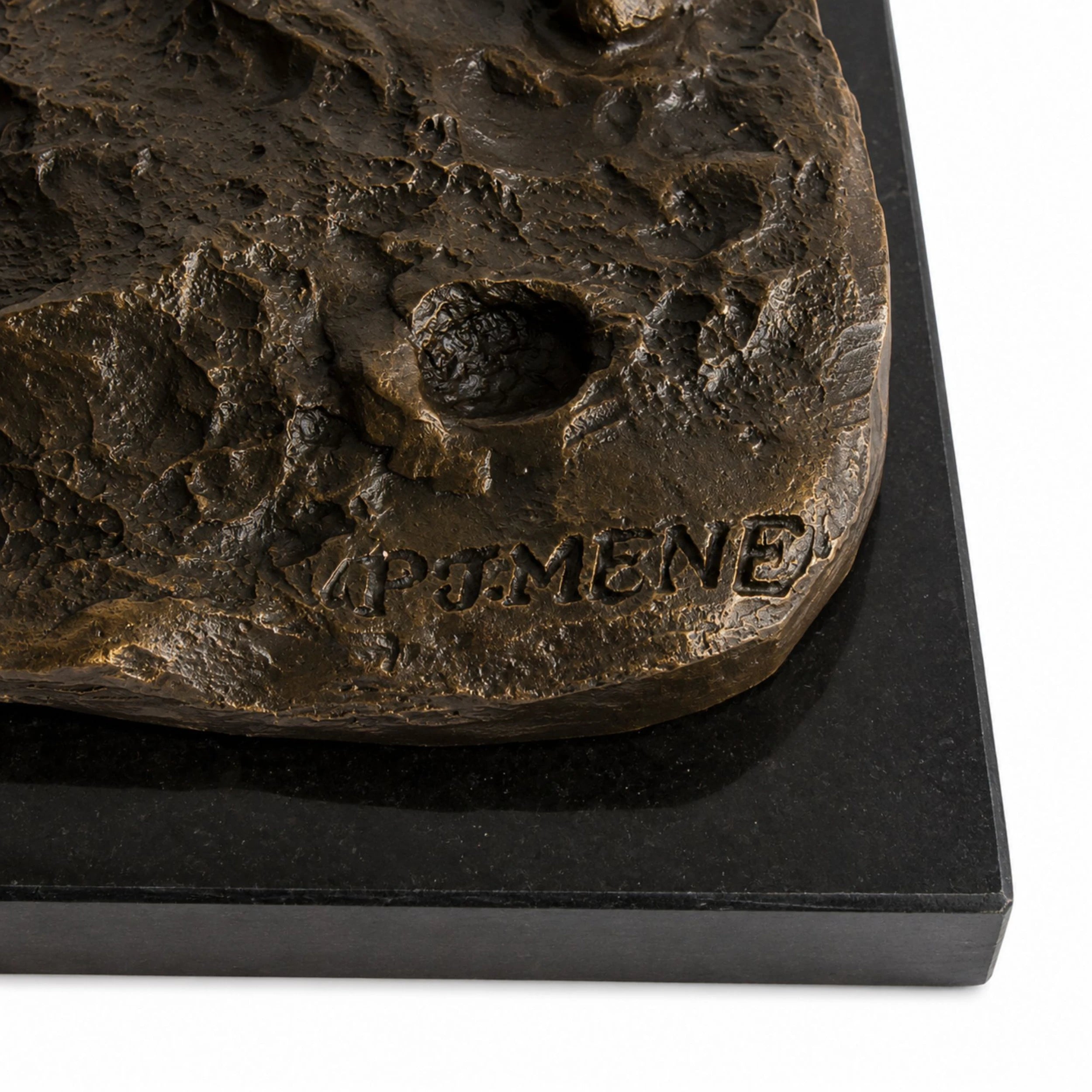 Detail of dark natural marble base supporting the bronze horse and dog sculpture