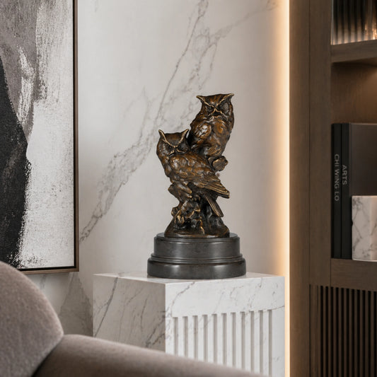 Realistic bronze sculpture featuring two owls perched on a tree stump with detailed feather textures. A refined wildlife artwork for collectors and nature lovers.