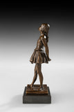 Left side view of bronze schoolgirl sculpture with youthful standing pose and warm patina