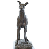 Close-up of bronze sighthound sculpture showing alert ears collar facial features and athletic body