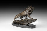 Close-up of bronze striding lion showing powerful shoulders, musculature, and sculpted surface texture
