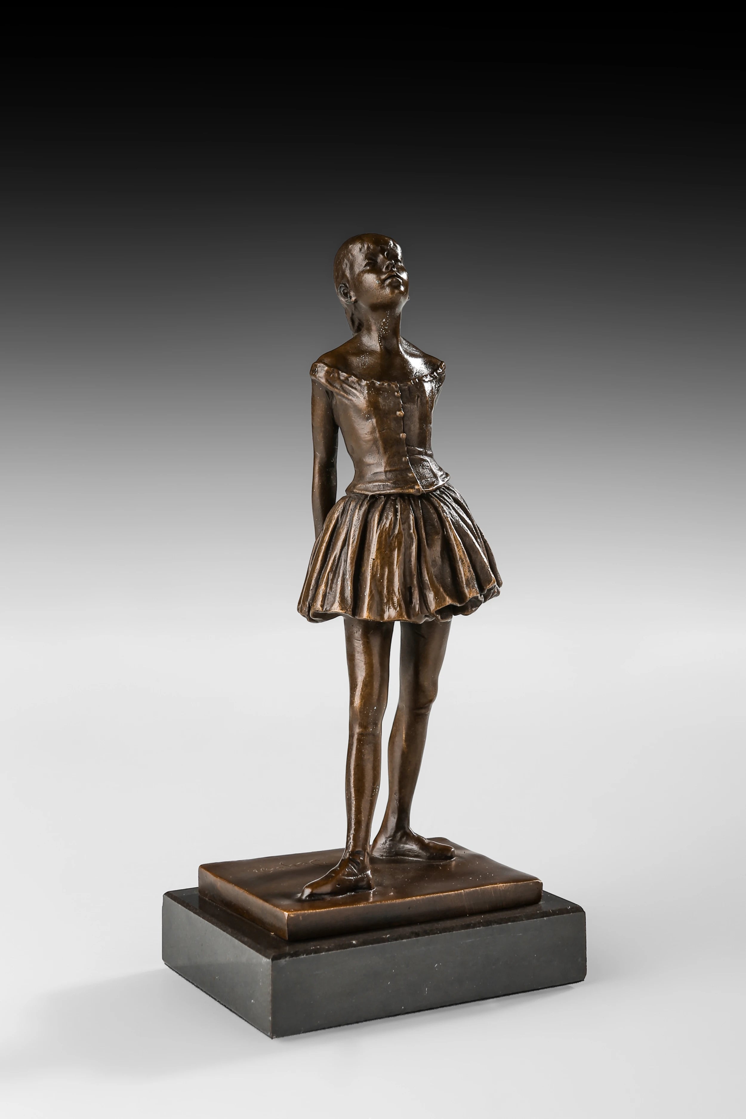 Right side view of handcrafted bronze student girl statue with detailed dress and shoes