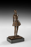Right side view of handcrafted bronze student girl statue with detailed dress and shoes