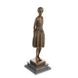 Left side view of bronze female figure sculpture with slender silhouette and vintage styling
