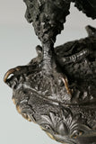 Bronze eagle statue with wings partially spread and decorative base. Classical wildlife sculpture for home decor, office, or collectors.